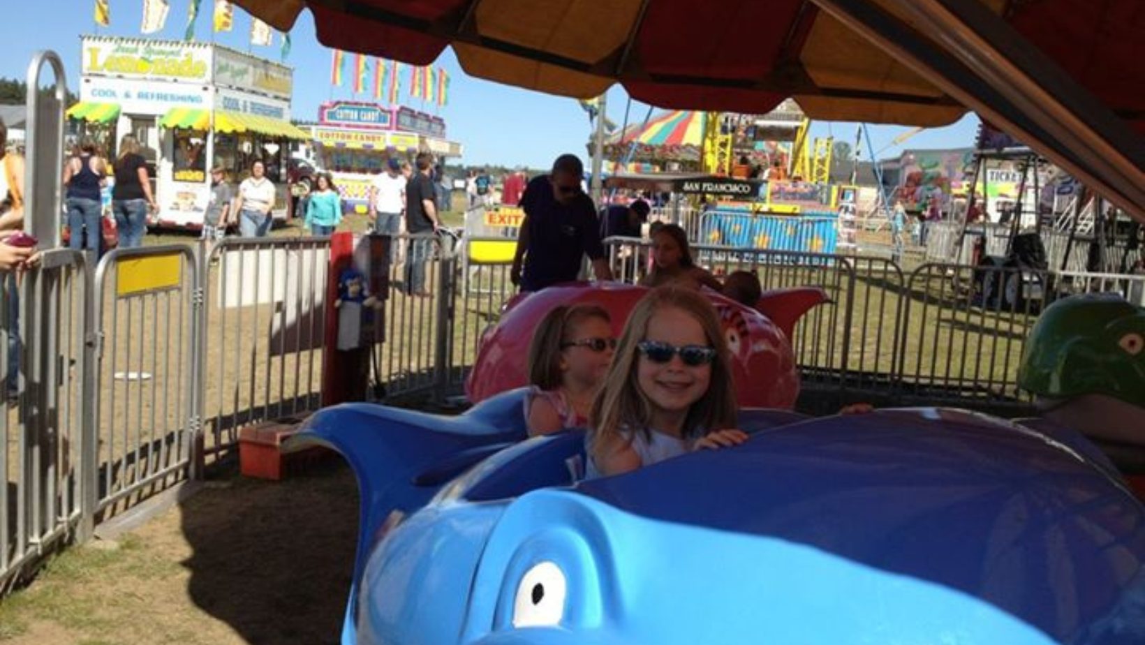 Sisters Lily and Aevryn (our cousins) on a ride at a local carnival back in 2012! August in Traverse City means festivals, concerts, markets, and more! Discover the top events near Dyer Lake Vacation Home.